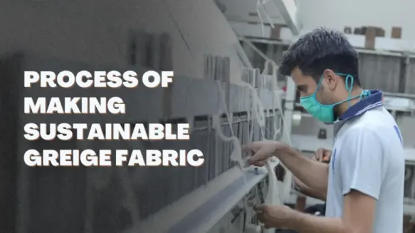 Worker operating greige cotton fabric production loom