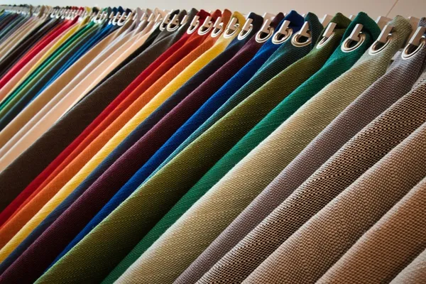 Wide range of coloured fabric rolls representing 40+ export markets